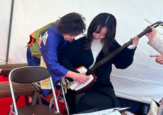 Playing a shamisen. For illustrative purposes only.